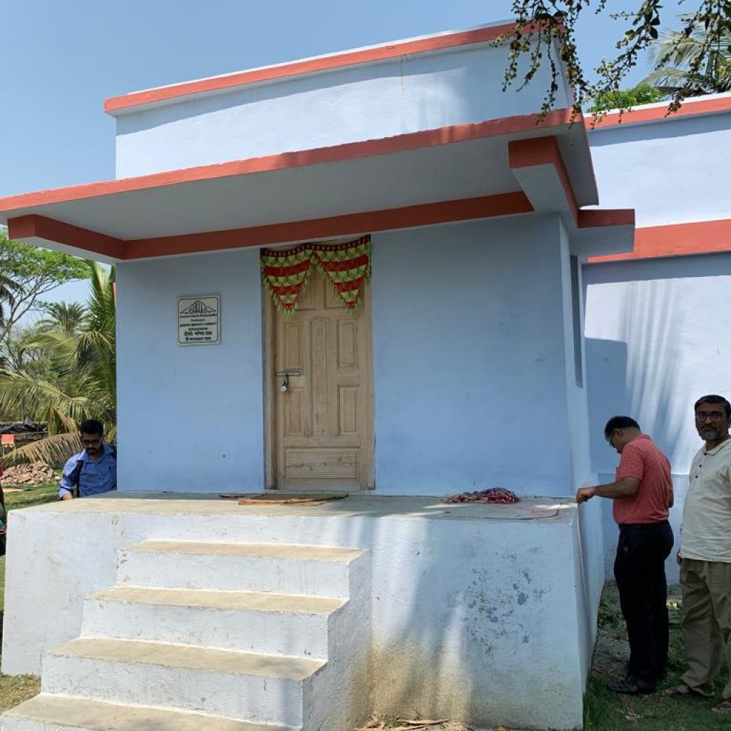 Site visit team looking at completed house
